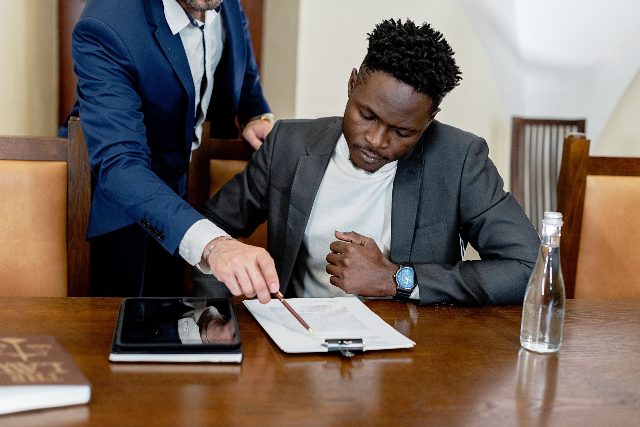 Attorney reviewing legal documents with a corporate client