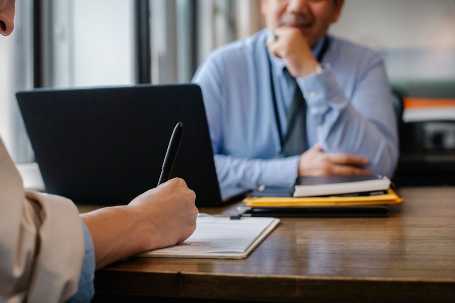 Business client reviewing commercial documents during a legal consultation